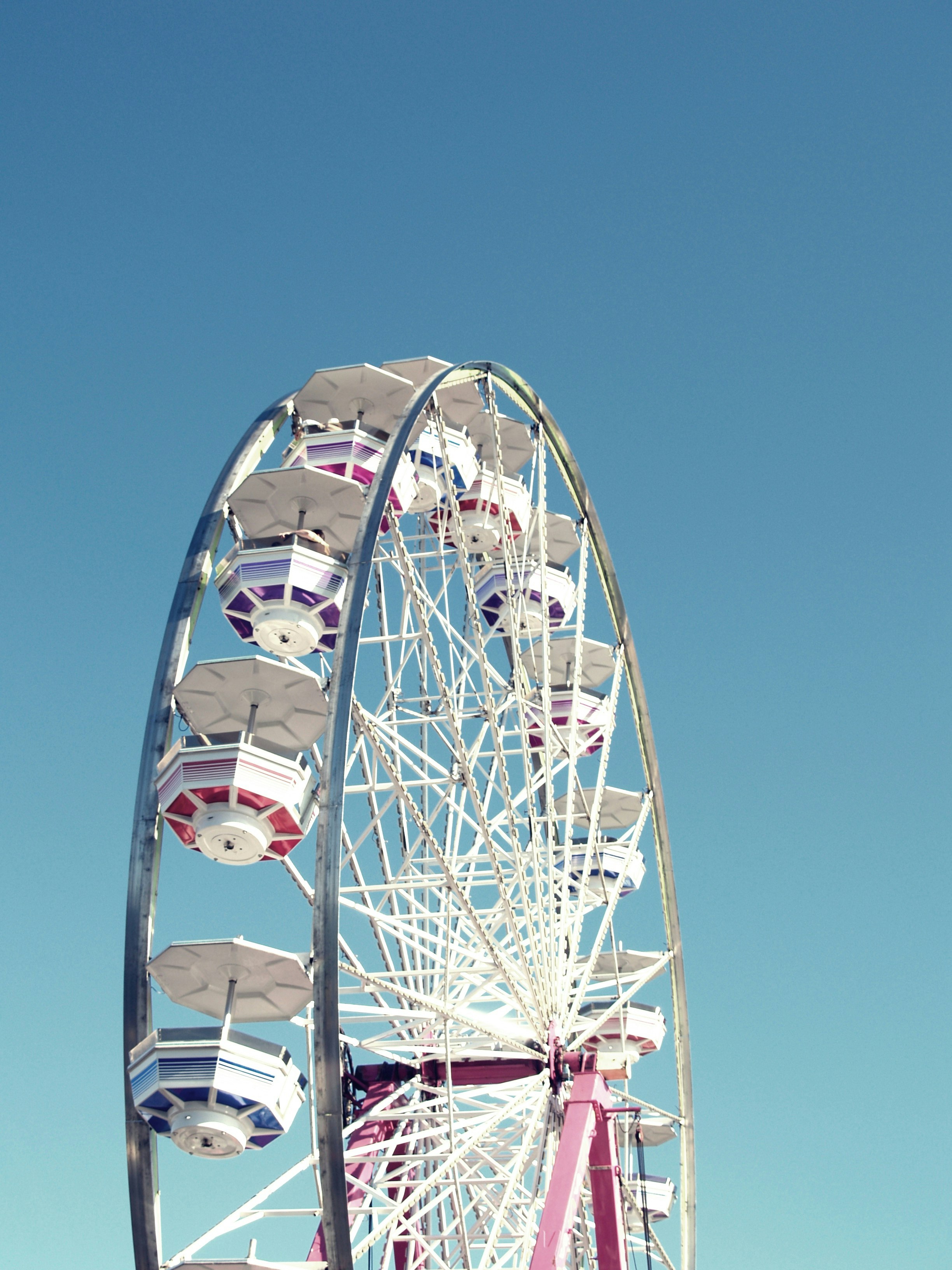 white ferris wheel under clear sky during daytime